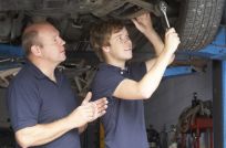 Two mechanics working on car repairs in Auckland